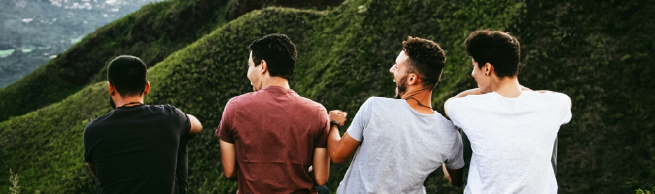 Four men bonding on a hike