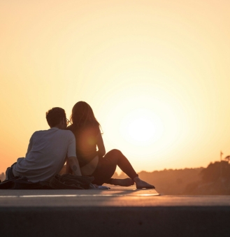 couple on dock at sunset